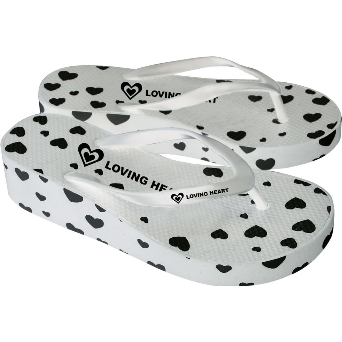 A pair of white platform thongs featuring a heart pattern and a logo on the strap.