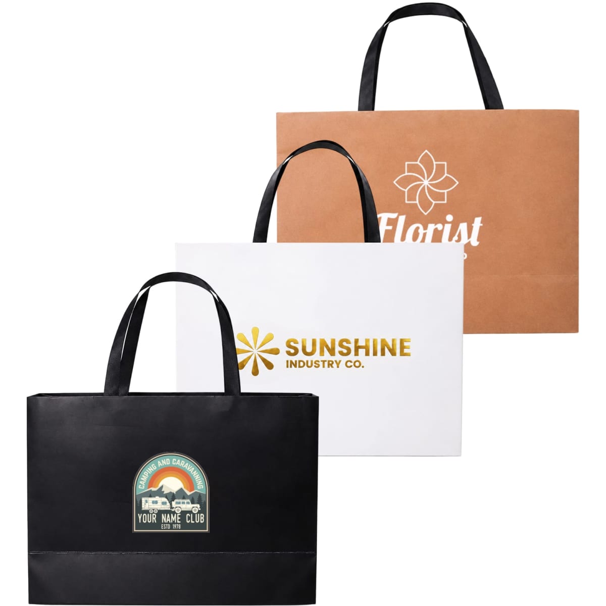 Three large paper bags in brown, white, and black, featuring flat handles and various logos.