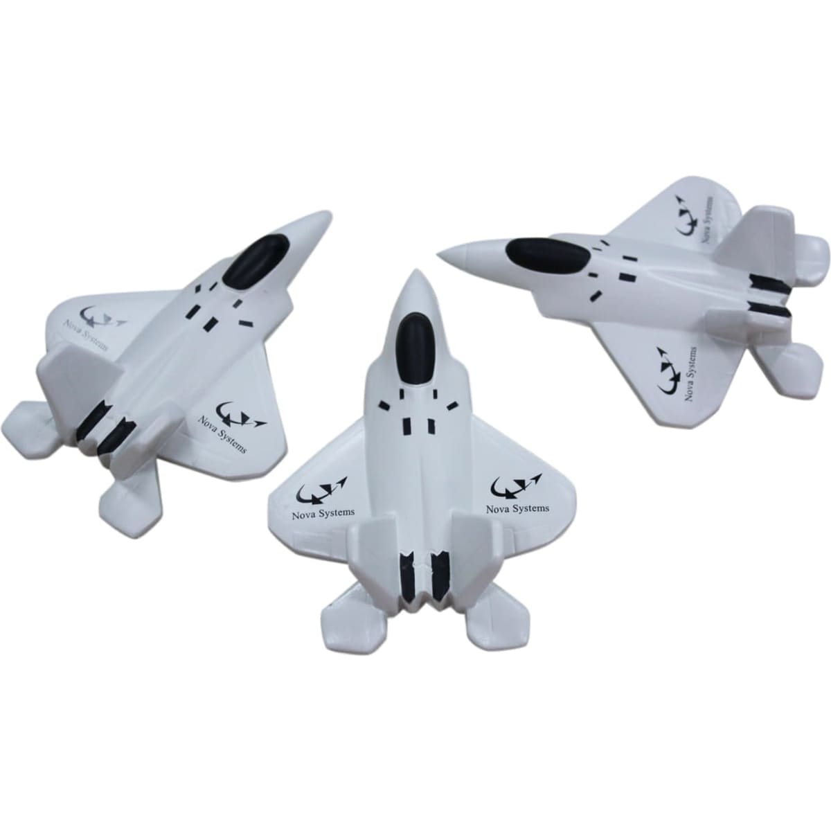Three white stress relievers shaped like fighter jets, featuring a logo and sleek designs.