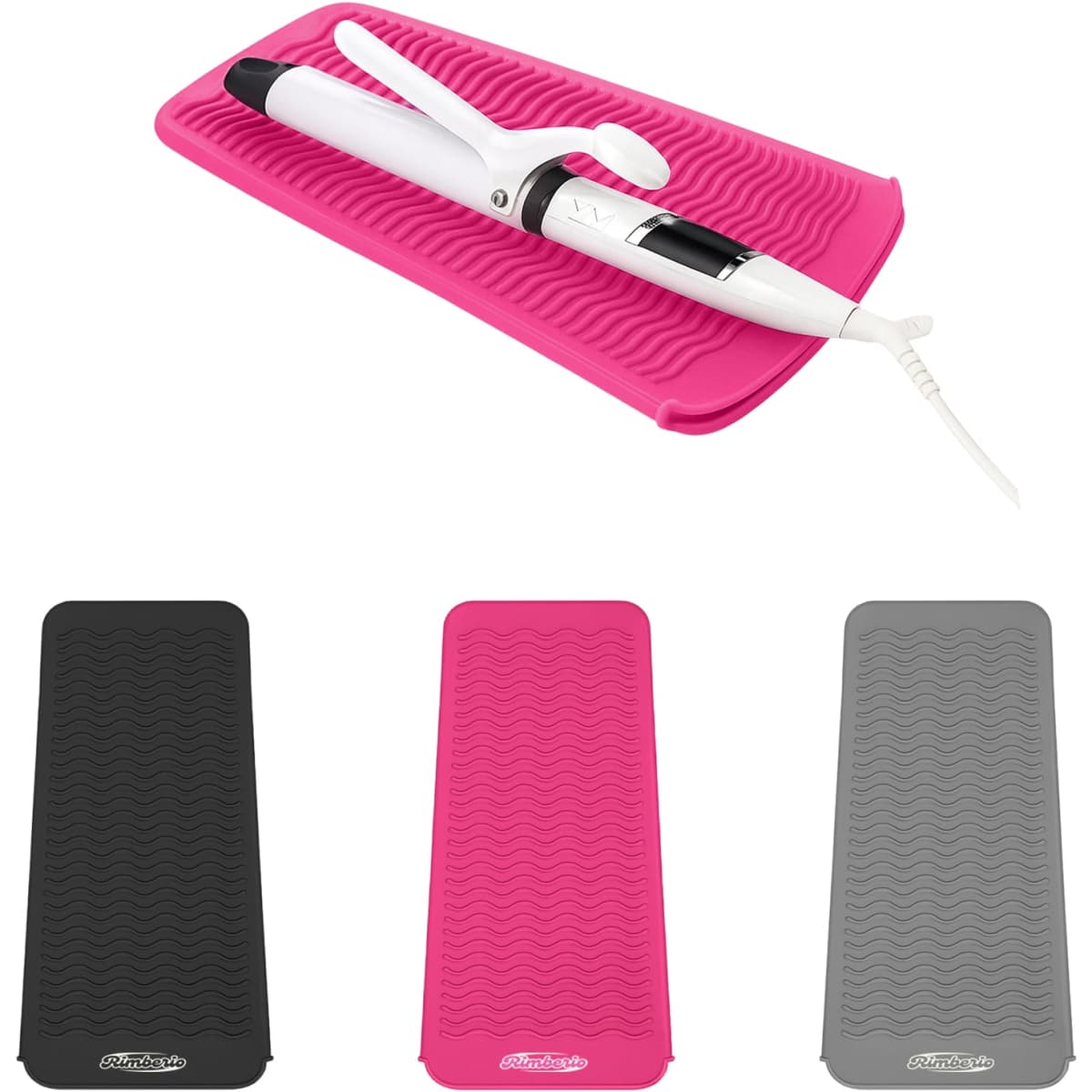 A pink heat resistant silicone mat pouch with a white styling tool on it, alongside black and grey mat options.