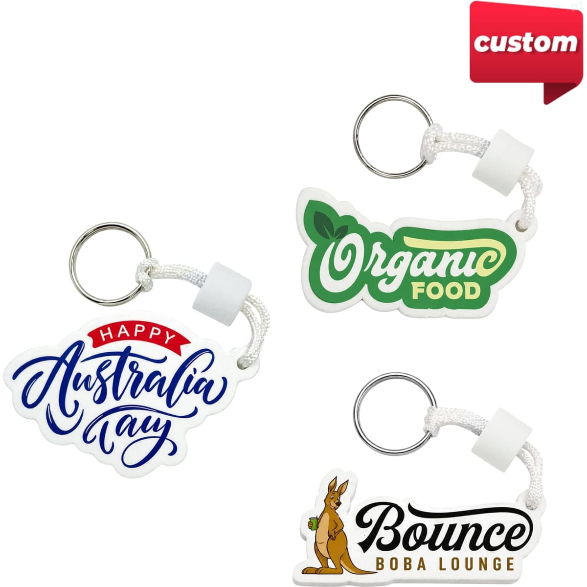 A set of three custom EVA floating keychains in various colours, featuring different designs and a metal ring.