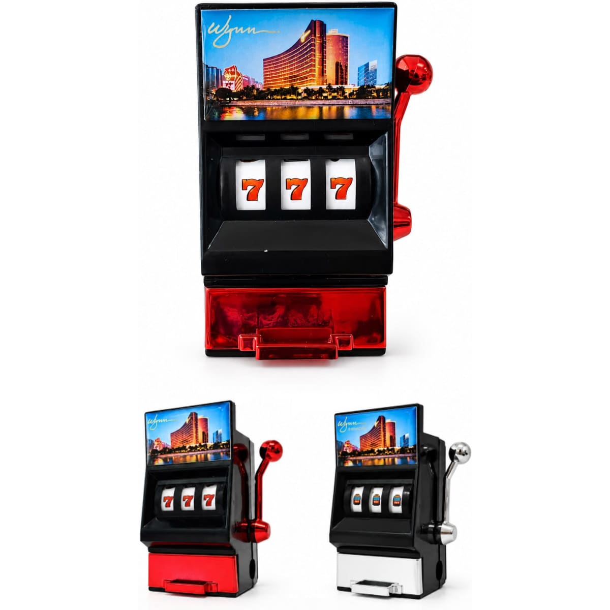 A vibrant red and black fridge magnet resembling a slot machine, complete with a sharpener and a scenic backdrop.