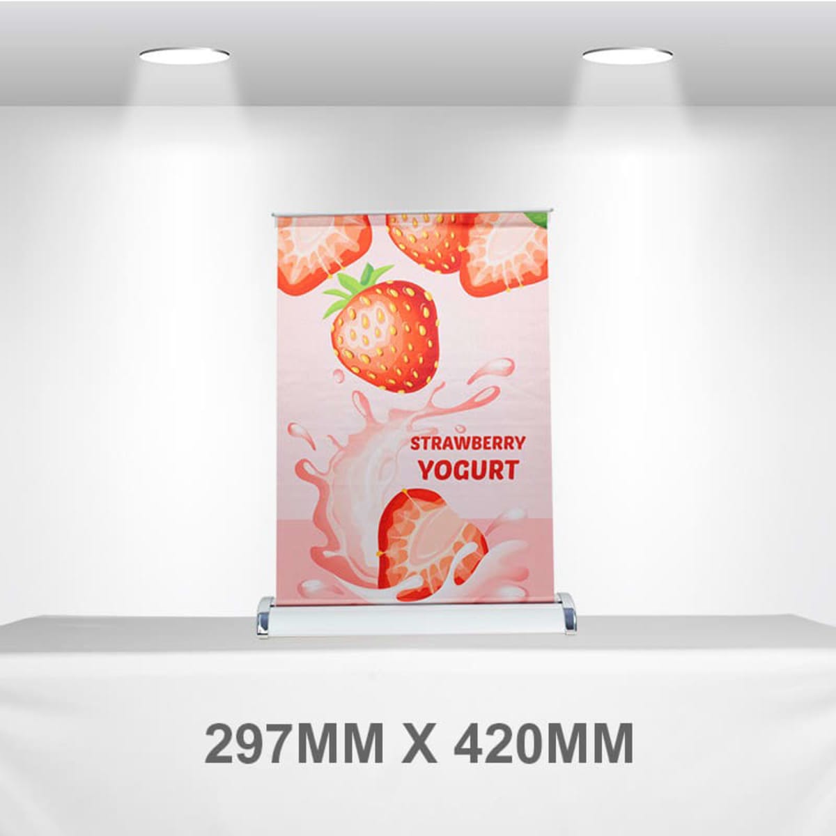 A pull-up banner featuring a pink design with strawberries and yogurt imagery. It includes a logo at the bottom.