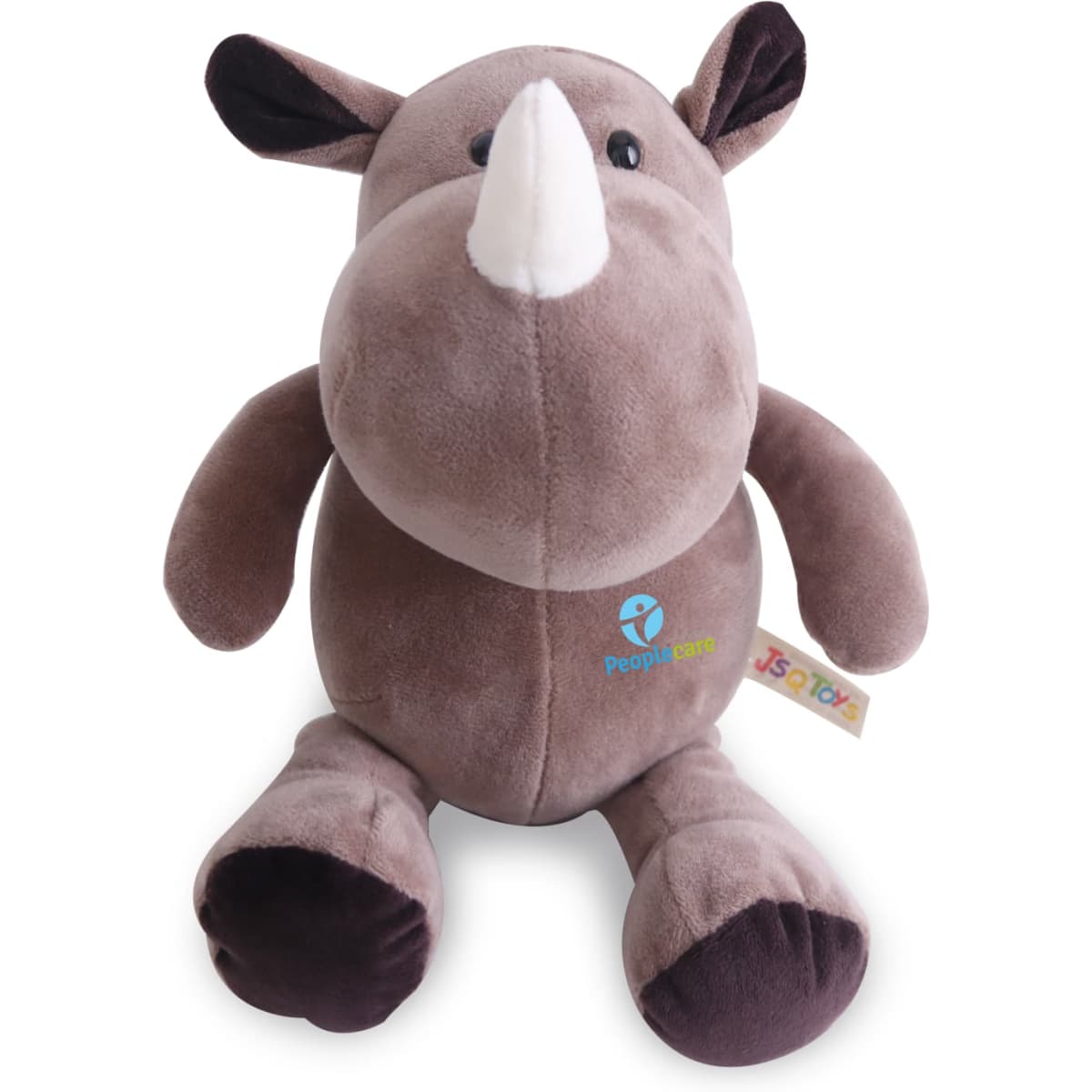 A brown rhinoceros plush toy with soft fabric, a white horn, and a small branding logo on its belly.