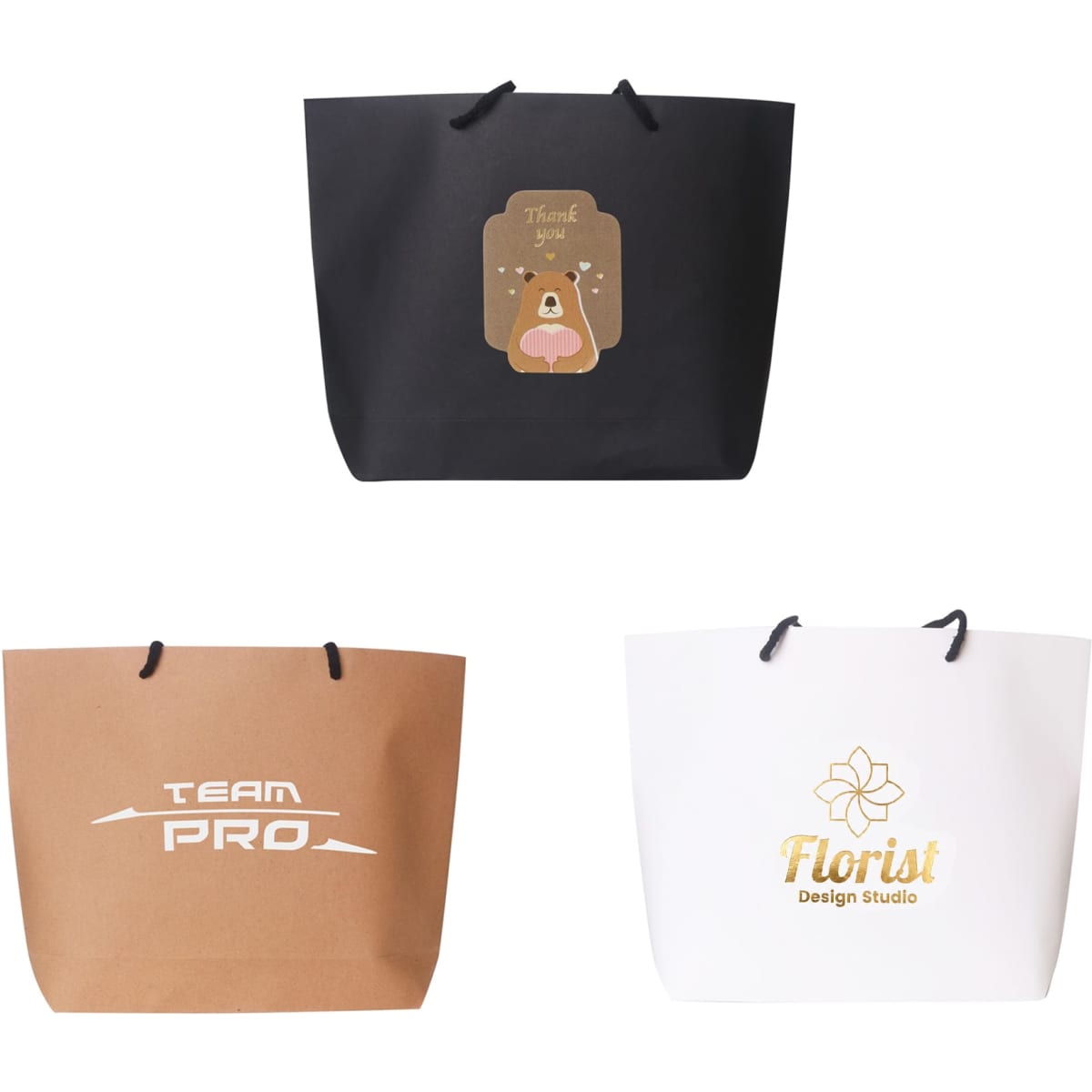 Three paper bags in black, brown, and white, each featuring different designs and a logo.