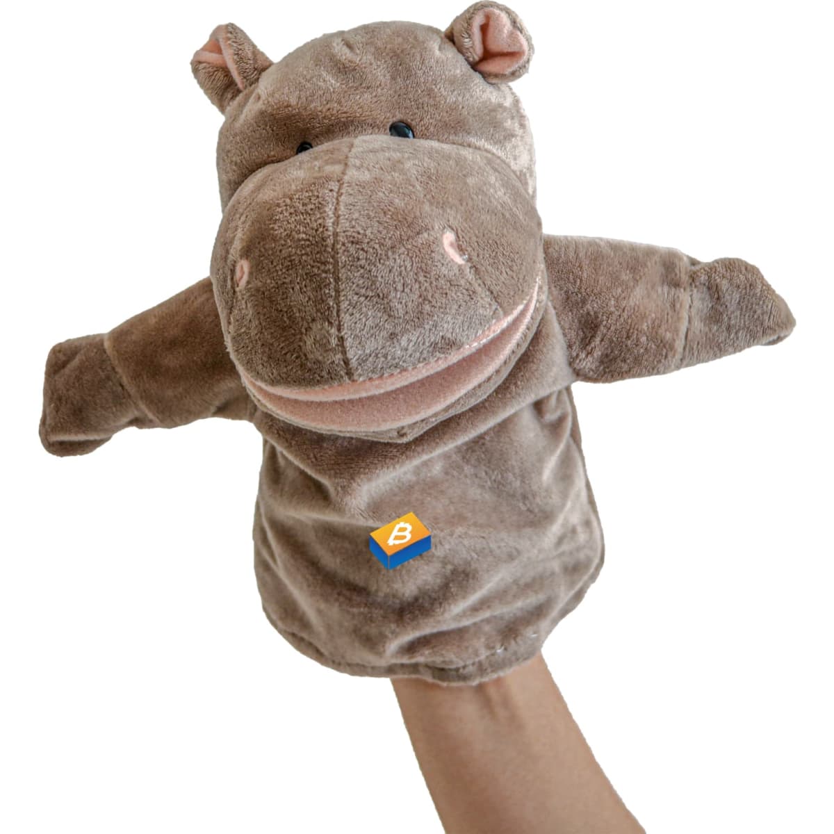 A plush hippo hand puppet in brown, featuring a smiling face and soft fabric, held by a hand.