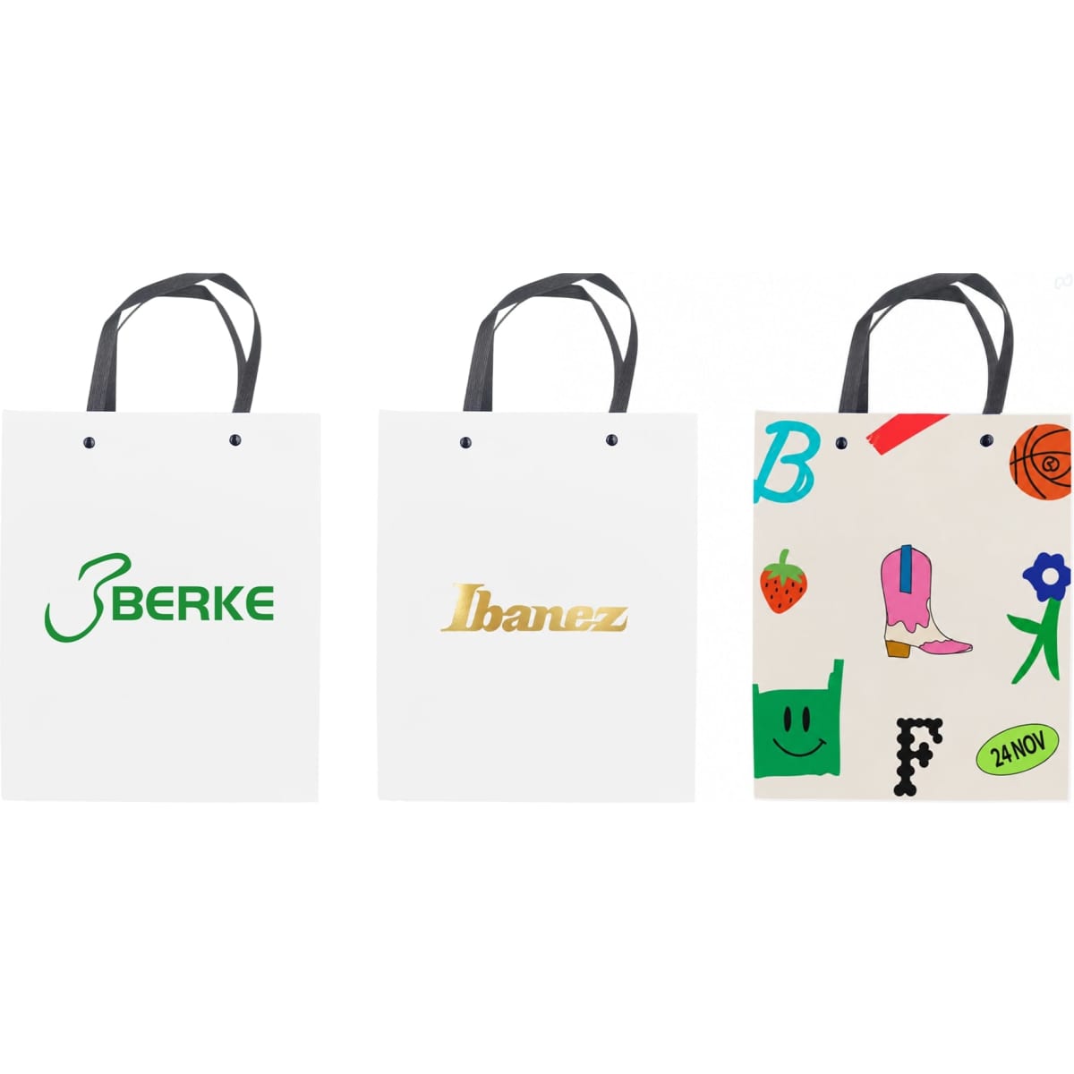 A collection of three white paper bags with knitted handles, each featuring different logos and colourful designs.