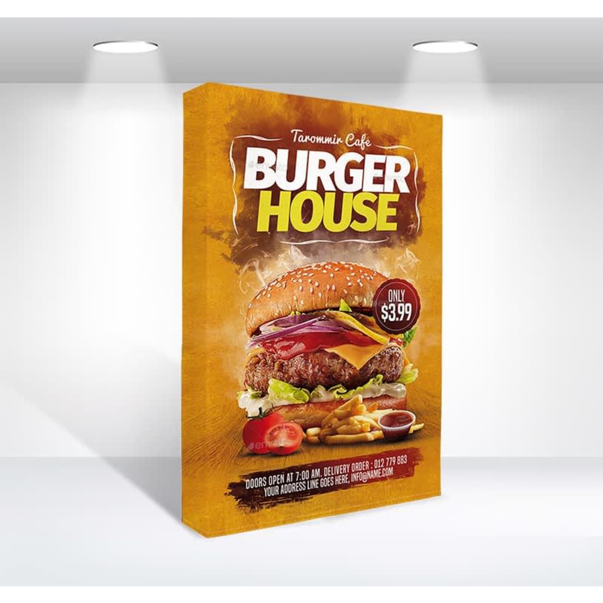 A promotional display featuring a large, colourful hamburger with various toppings, set against a vibrant yellow background.