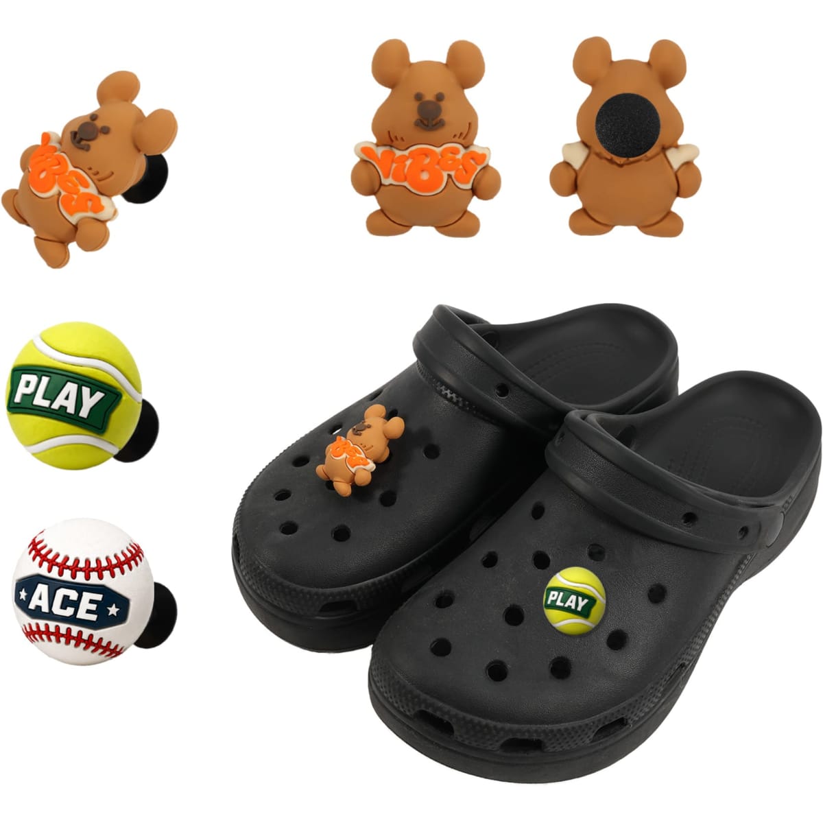 Black clog shoes with 3D brown bear charms and two sports-themed charms, including a tennis ball and a baseball.