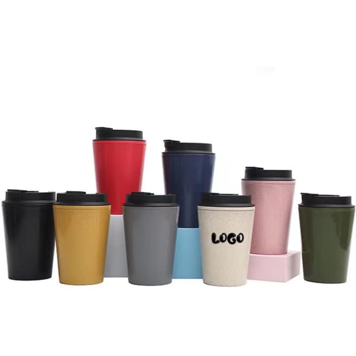 A collection of double wall wheat straw coffee cups in various colours, each with a black lid and some featuring logos.