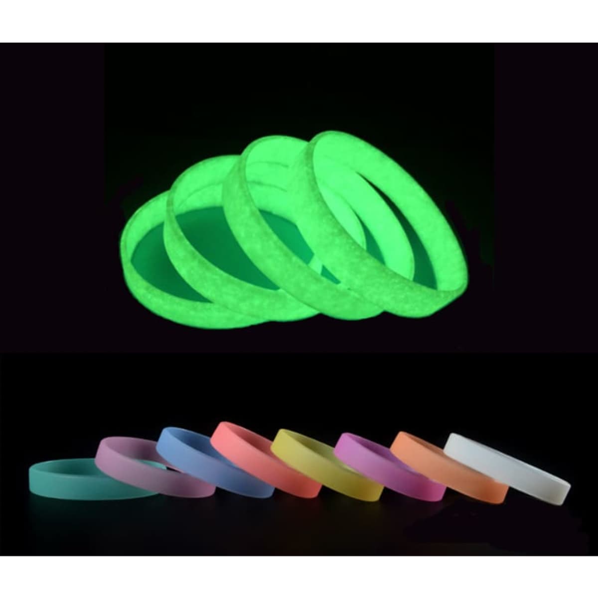Glow in the dark silicone wristbands in vibrant colours, including pink, orange, purple, and white, displayed against a dark background.