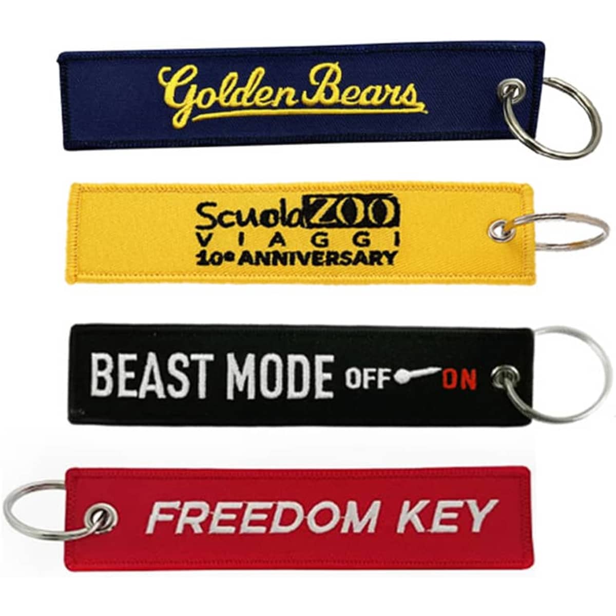 Four embroidered key tags in blue, yellow, black, and red, each attached to metal rings.