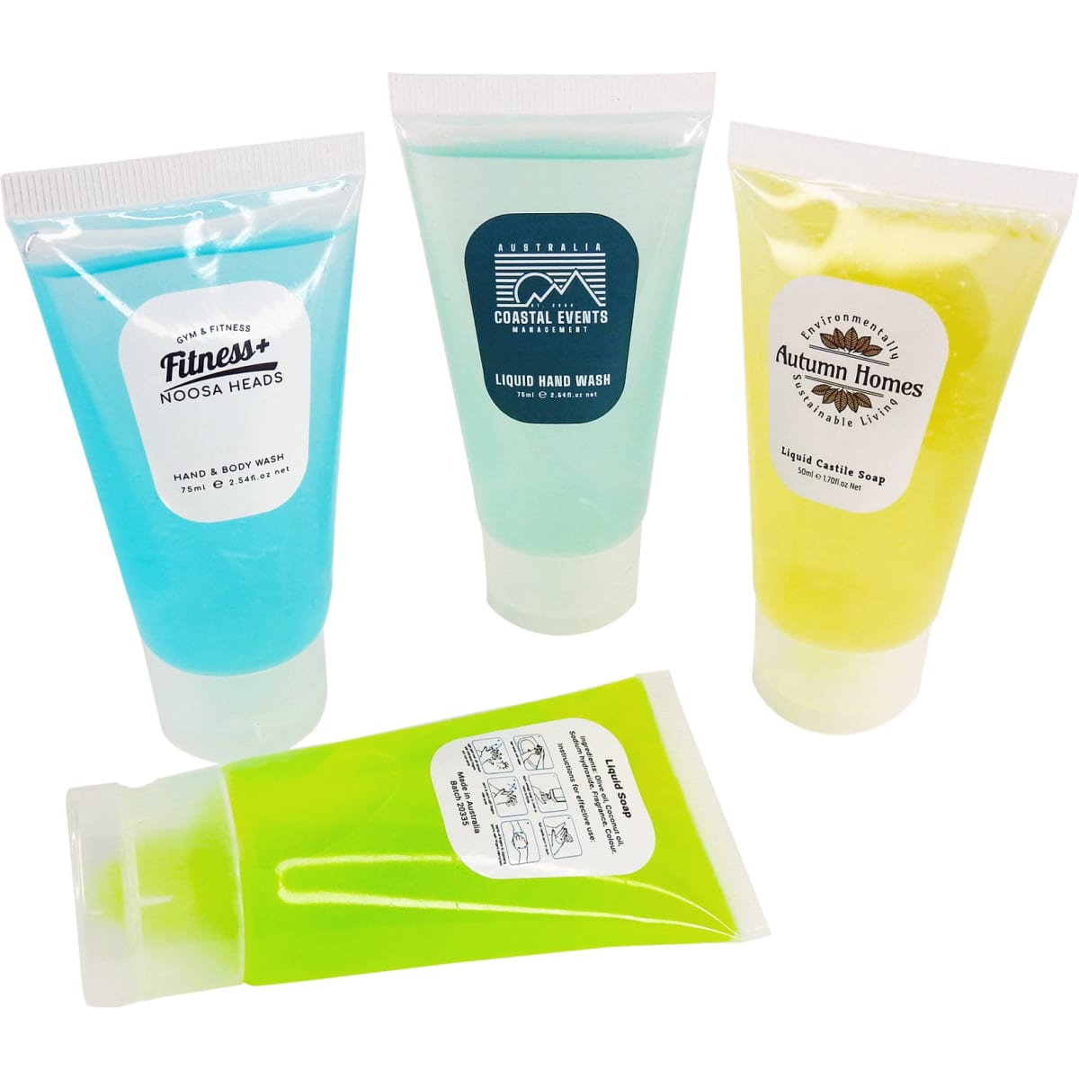 Four squeeze tubes of hand and body wash in blue, yellow, and green. Each tube has a different design and branding.