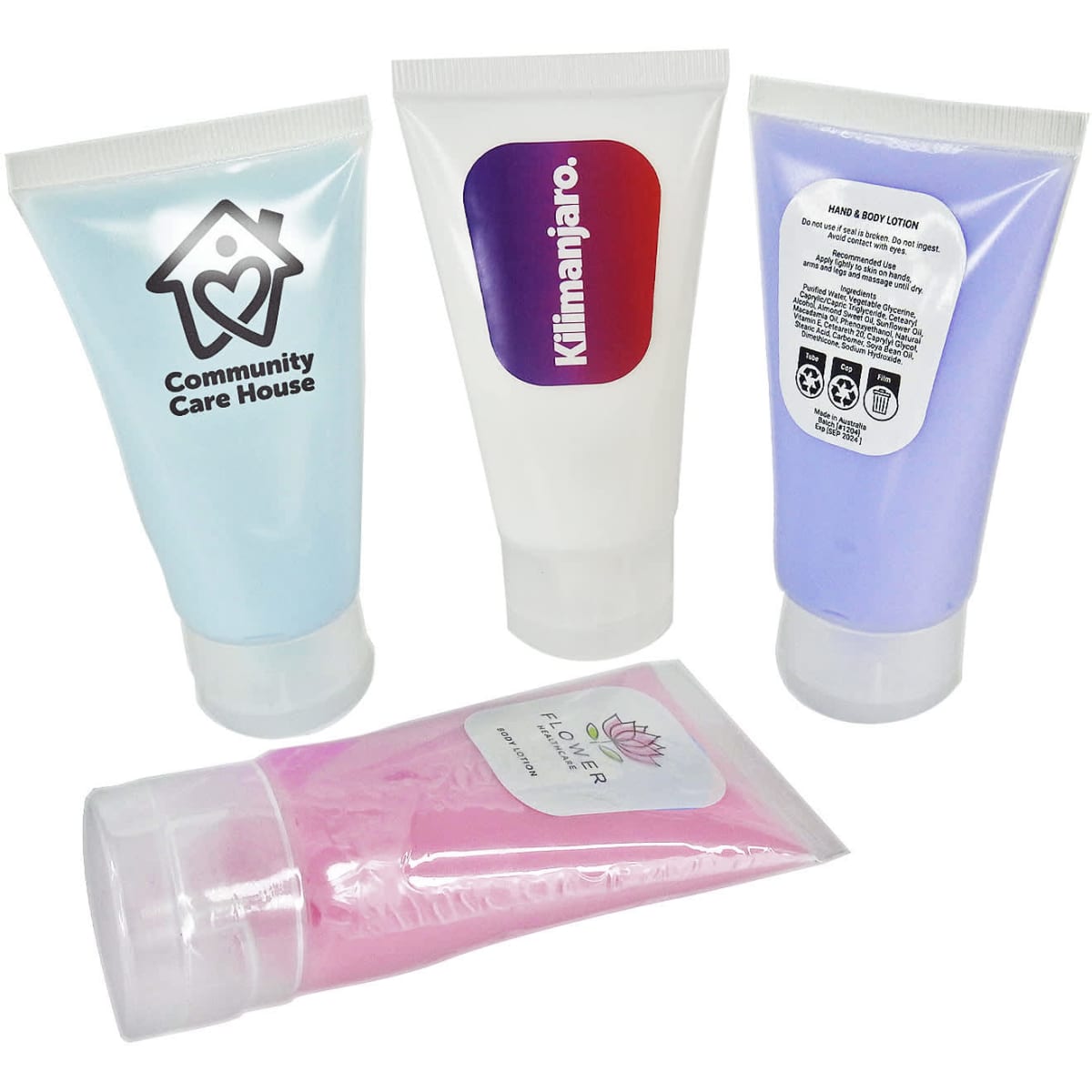 A set of four lotion tubes in light blue, purple, and pink, each with different branding and designs.