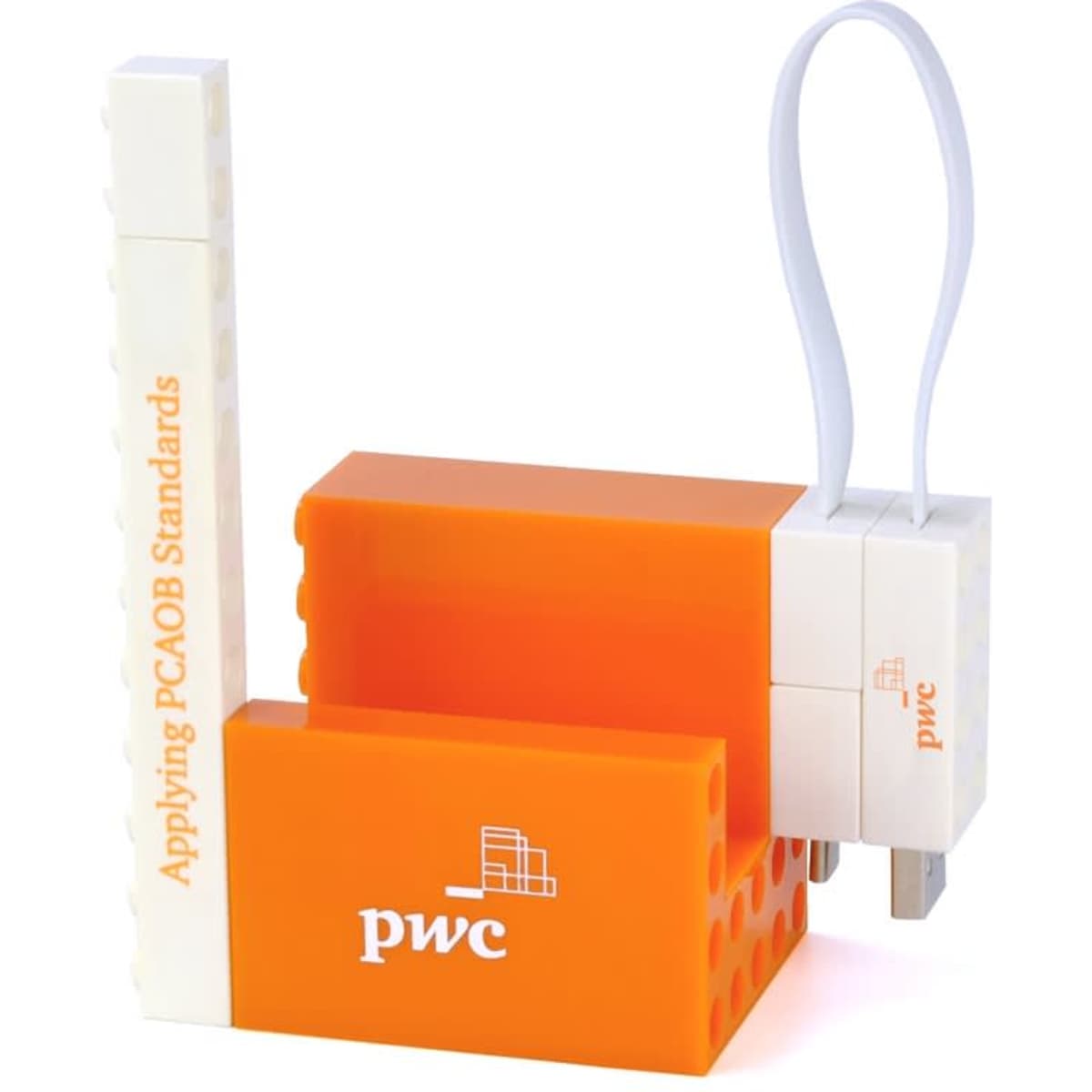 An orange and white phone stand set with a logo and a connected charging cable.