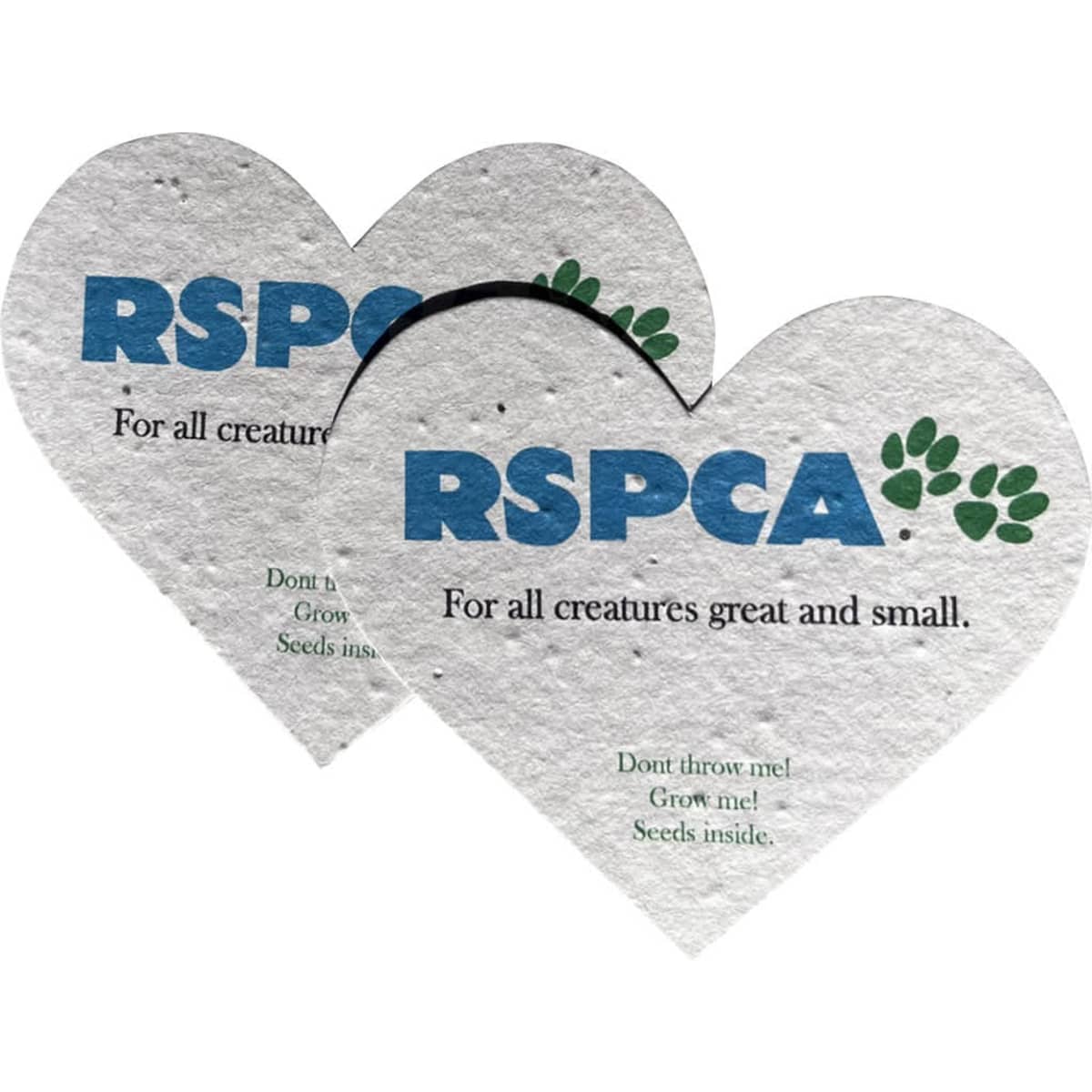 Two heart-shaped pieces of seed paper in cream, featuring a logo and text about planting seeds.