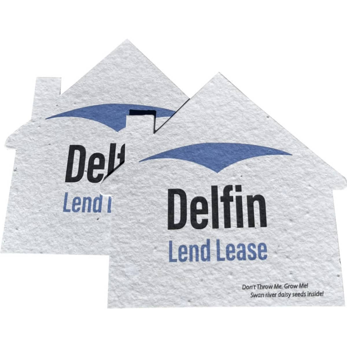 Two seed paper cards in the shape of houses, featuring a light blue roof and a logo, made from recycled material.