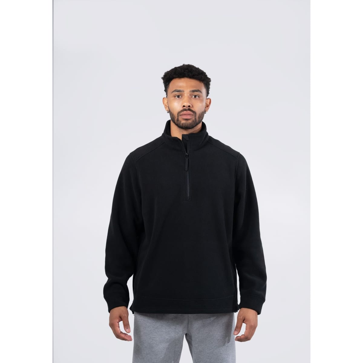 A men's/unisex polar fleece half zip top in olive green, featuring side pockets and a logo.