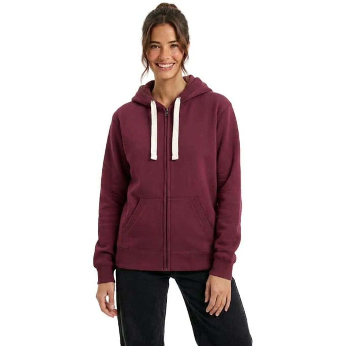 A zip fleece hoodie in burgundy, featuring a hood and contrasting drawstrings, worn by a smiling model.