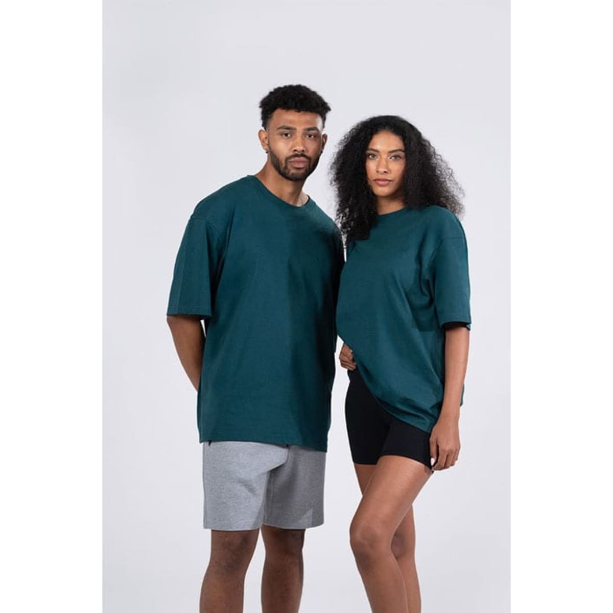 A cream-coloured unisex oversize easy-fit tee, featuring short sleeves and a simple design.