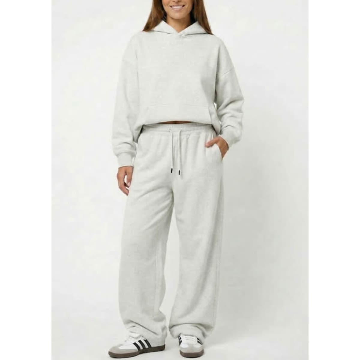 A pair of unisex wide-leg fleece pants in light grey, featuring a drawstring waist and side pockets.