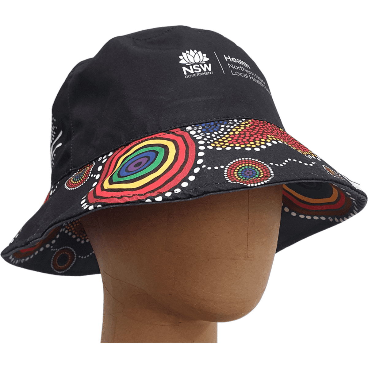 A black reversible bucket hat featuring a colourful Indigenous-inspired pattern, with a logo on the front.