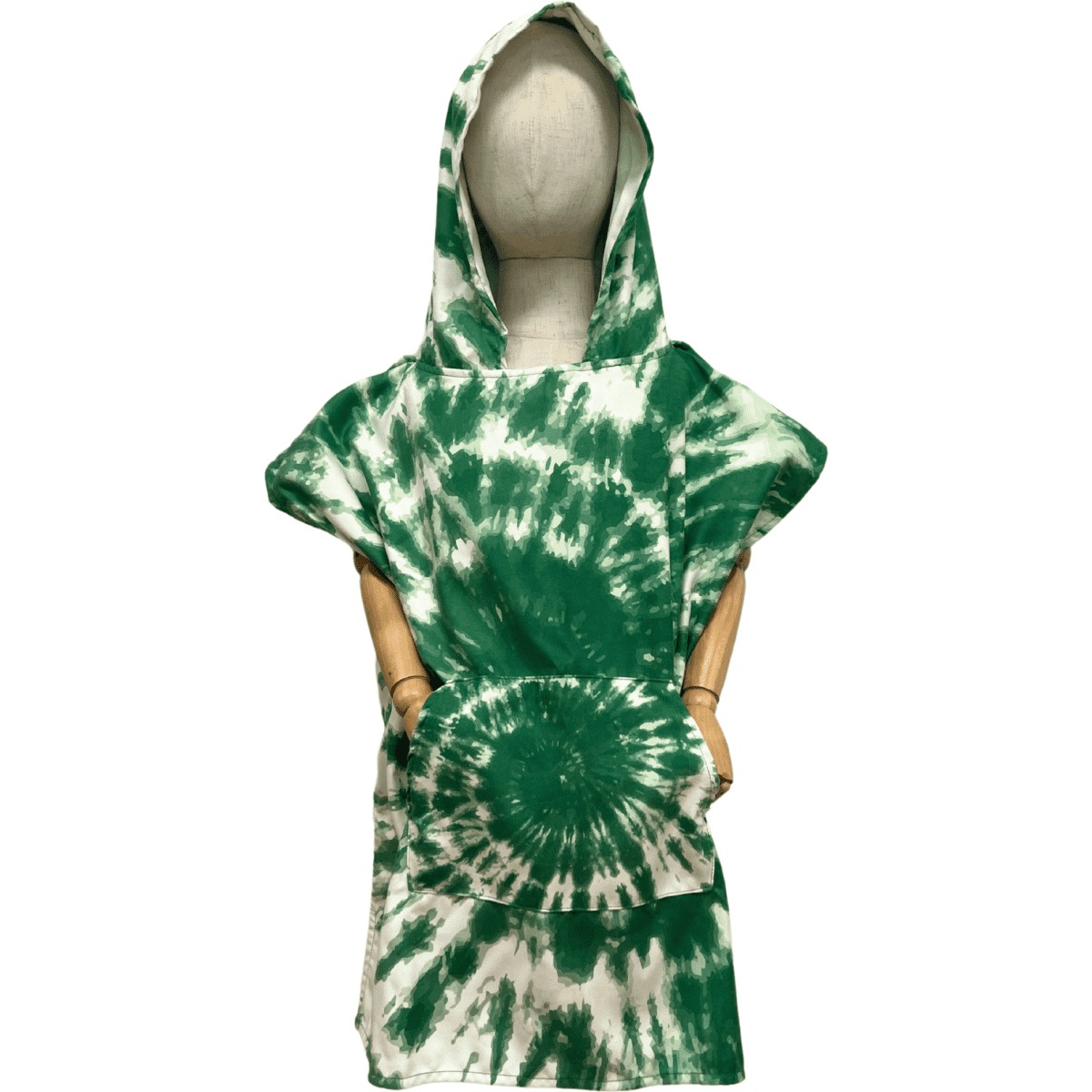 A green tie-dye kids poncho with a hood and a front pocket, displayed on a mannequin. It features a branding logo.