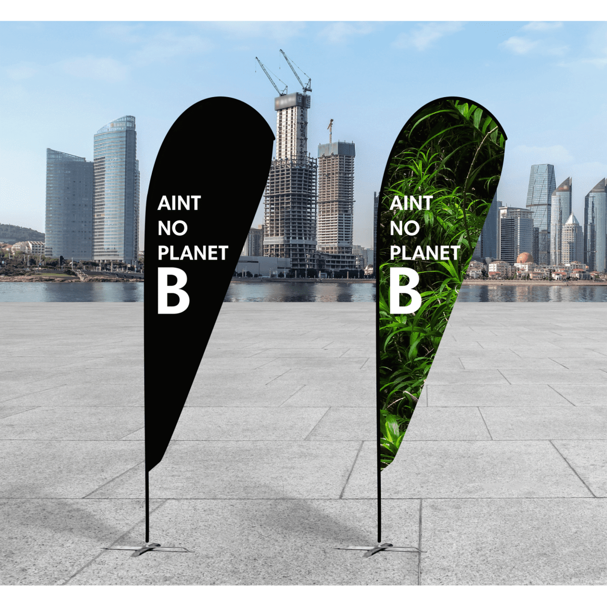 Two medium teardrop banners in black and green with a logo, displayed outdoors against a city backdrop.