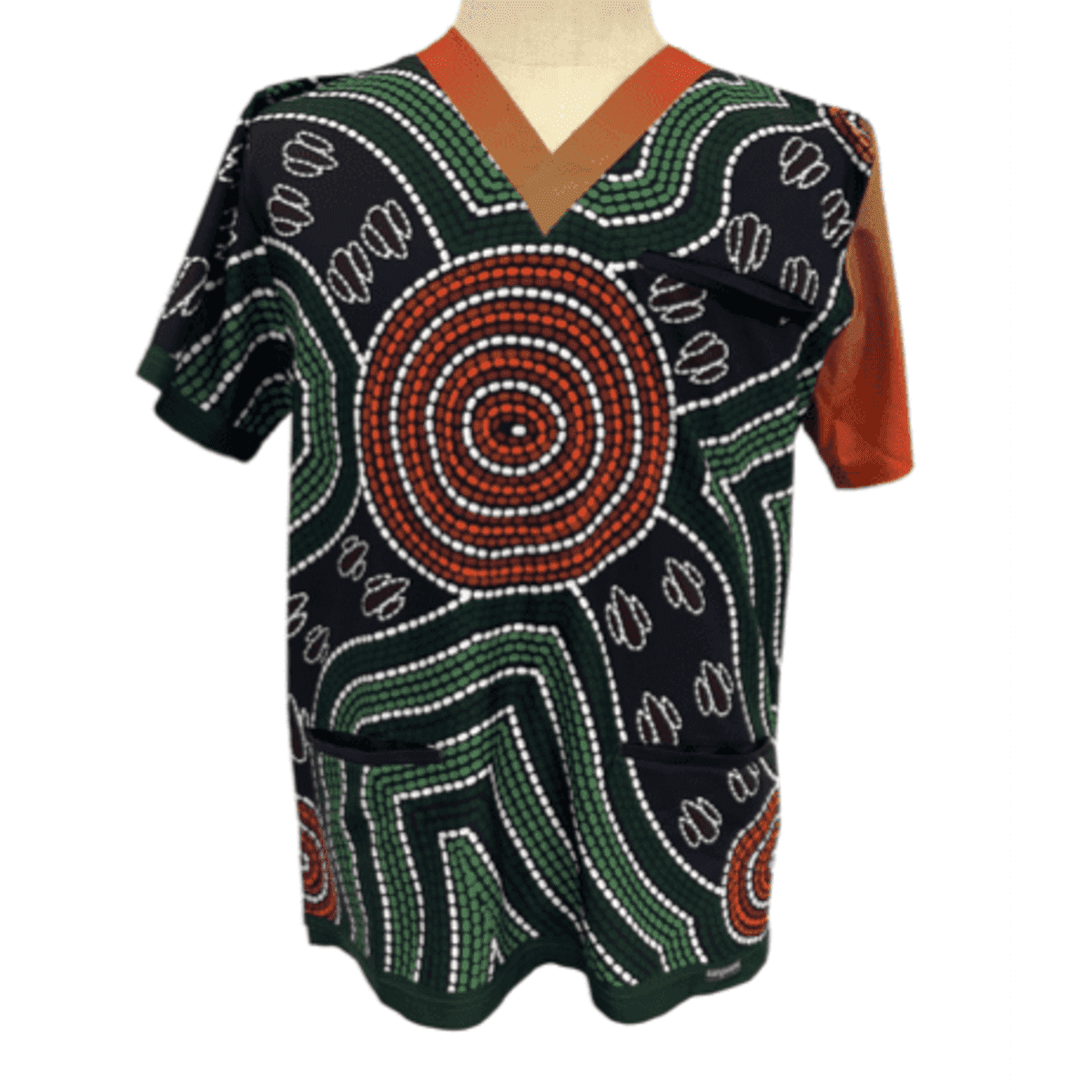 A vibrant scrub top featuring a distinctive Aboriginal-inspired pattern with greens, reds, and black. It has a logo and two pockets.