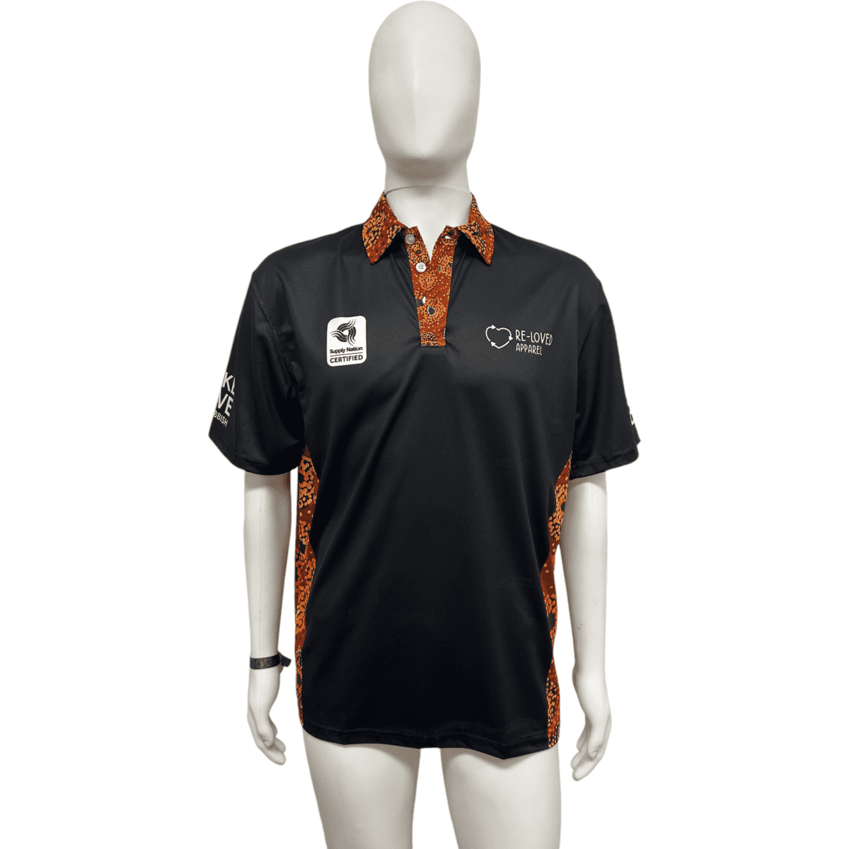 A black short sleeve polo shirt with patterned orange accents and a logo on the chest. It features a collar and is displayed on a mannequin.