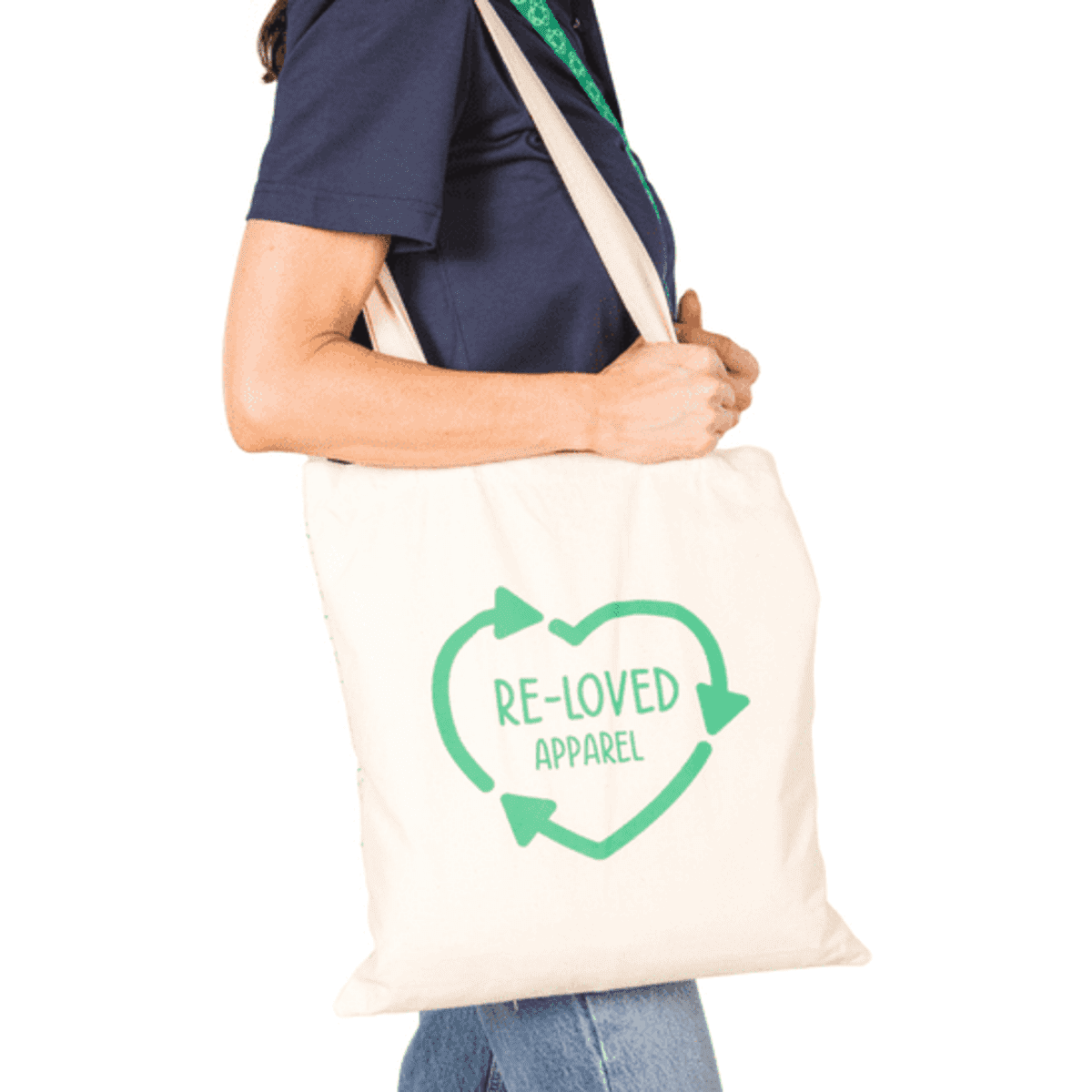 A natural coloured tote bag made of 220gsm organic cotton, featuring a heart design and a logo.