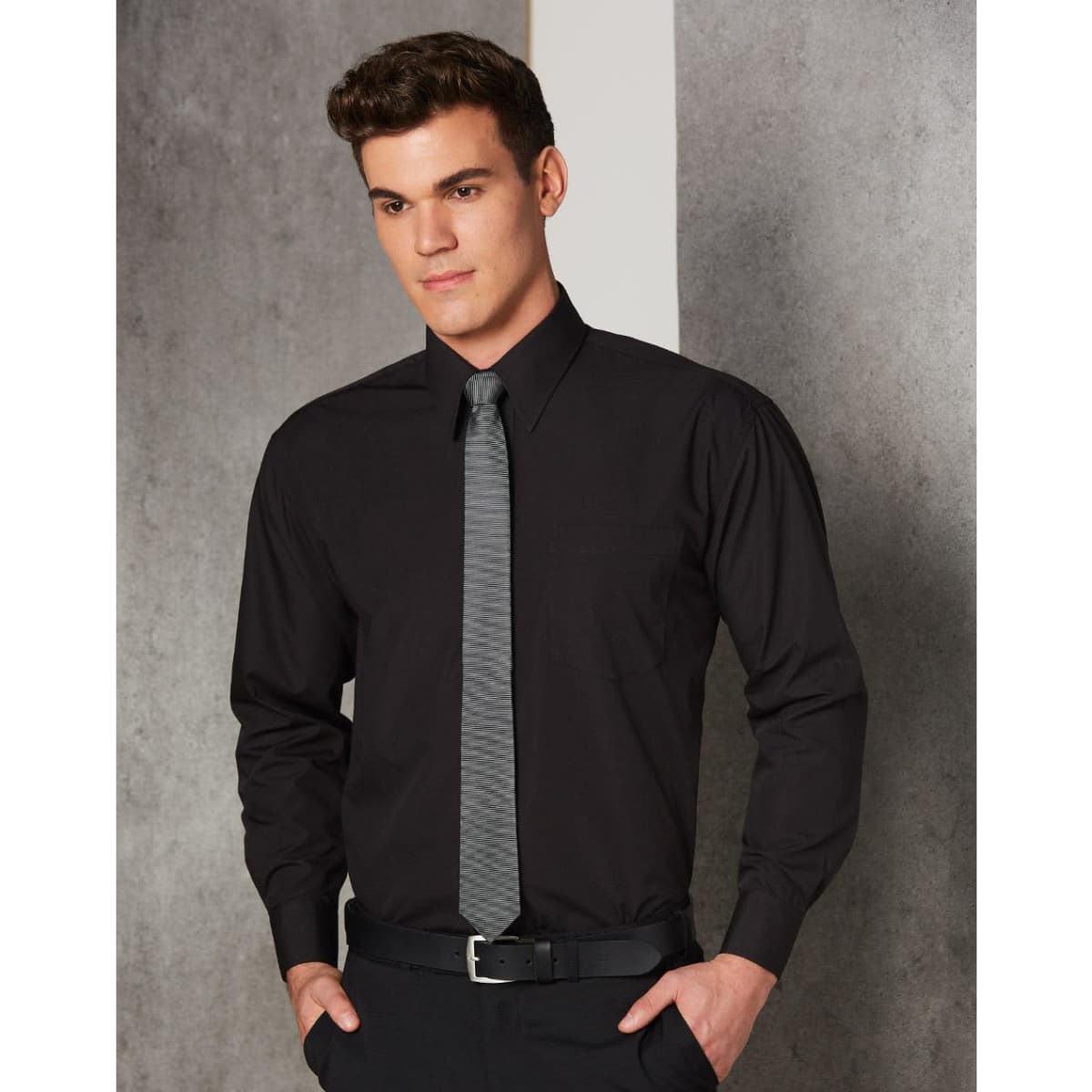 A black long sleeve business shirt with a collar, paired with a grey tie, and featuring a chest pocket.