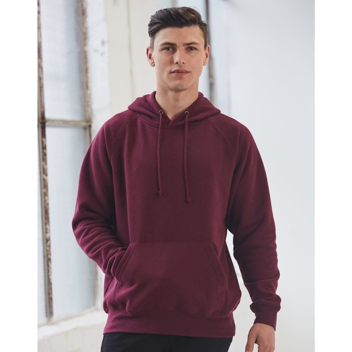 A maroon men's fleecy hoodie with a front pocket and an adjustable drawstring hood, featuring a logo.