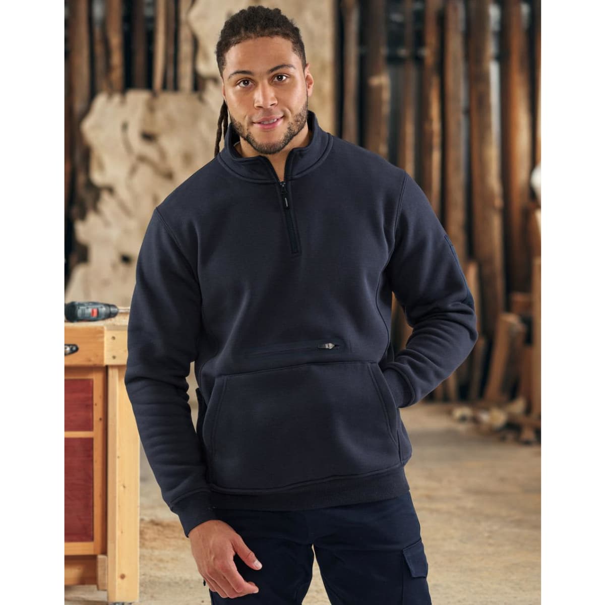 A navy unisex premium fleece half zip work sweat with a front pocket and an embedded logo.