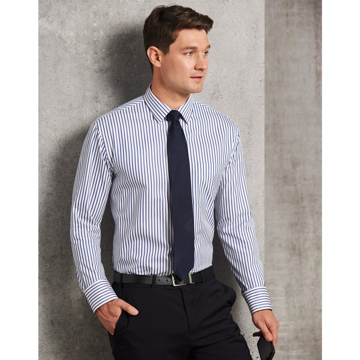 A men's long sleeve button-up shirt featuring navy and white sateen stripes, complemented by a dark tie and belt.