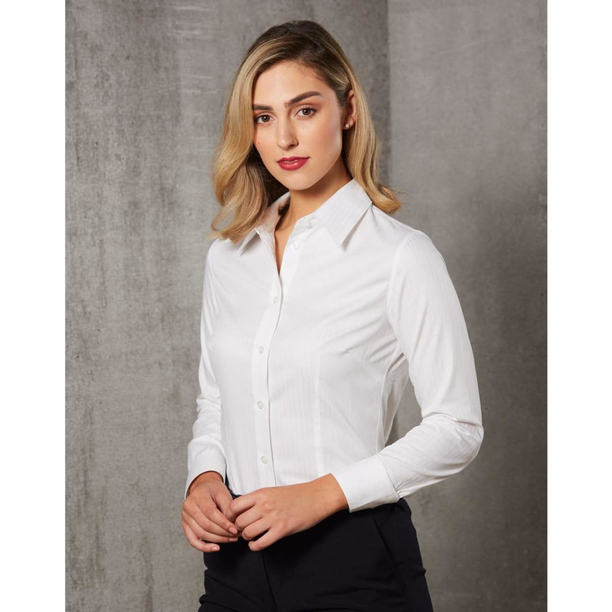 A white long-sleeve button-up shirt for women featuring self-stripe design, with a collar and button closure.