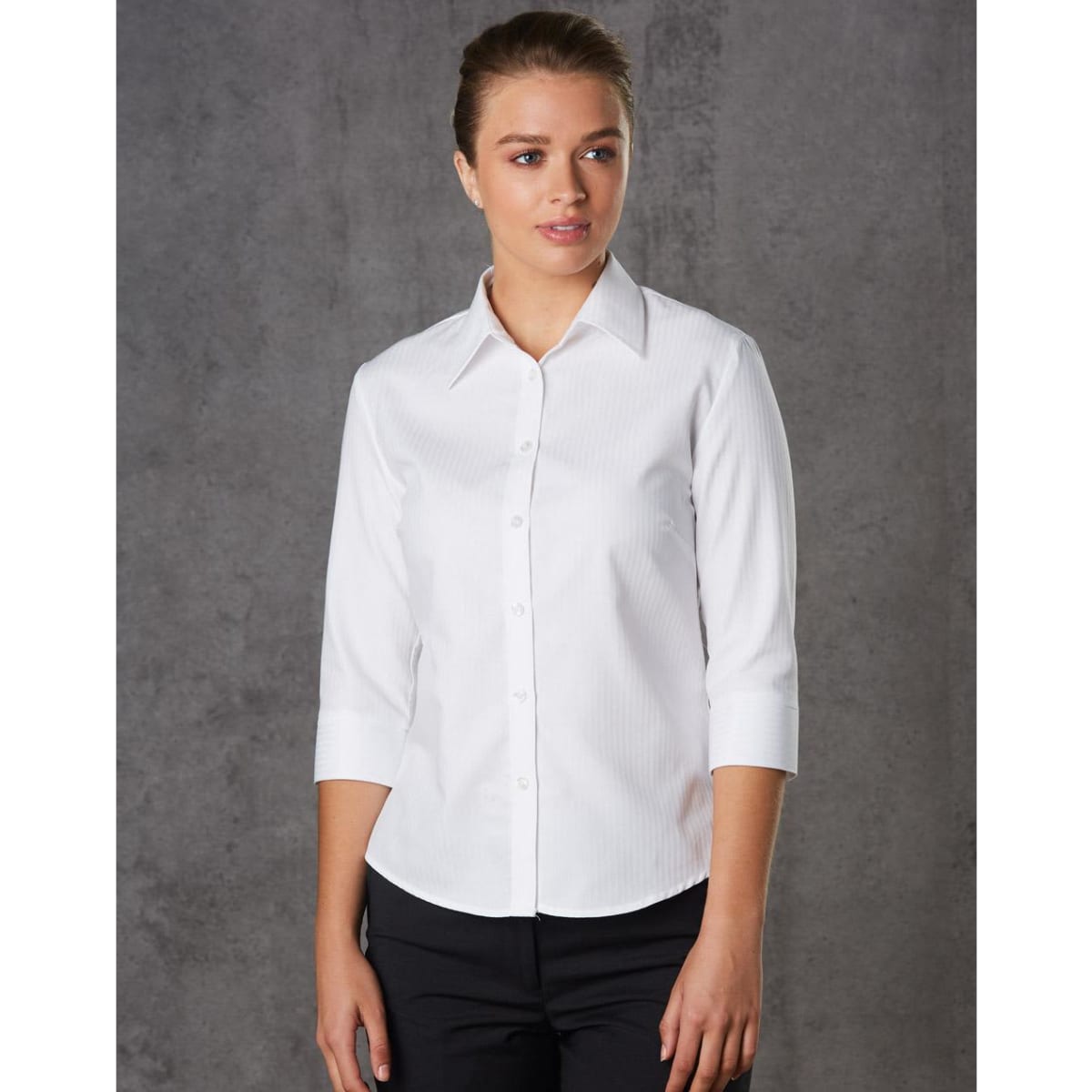 A white women's mini herringbone 3/4 sleeve button-up shirt with a collared neckline and a subtle pattern.