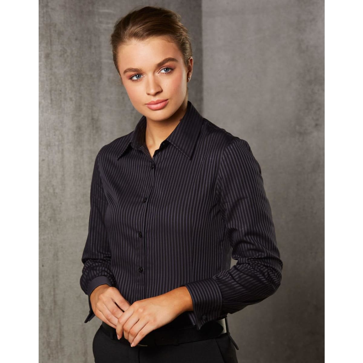 A long sleeve button-up shirt in dark grey with a subtle dobby stripe pattern, featuring a classic collar and buttons.