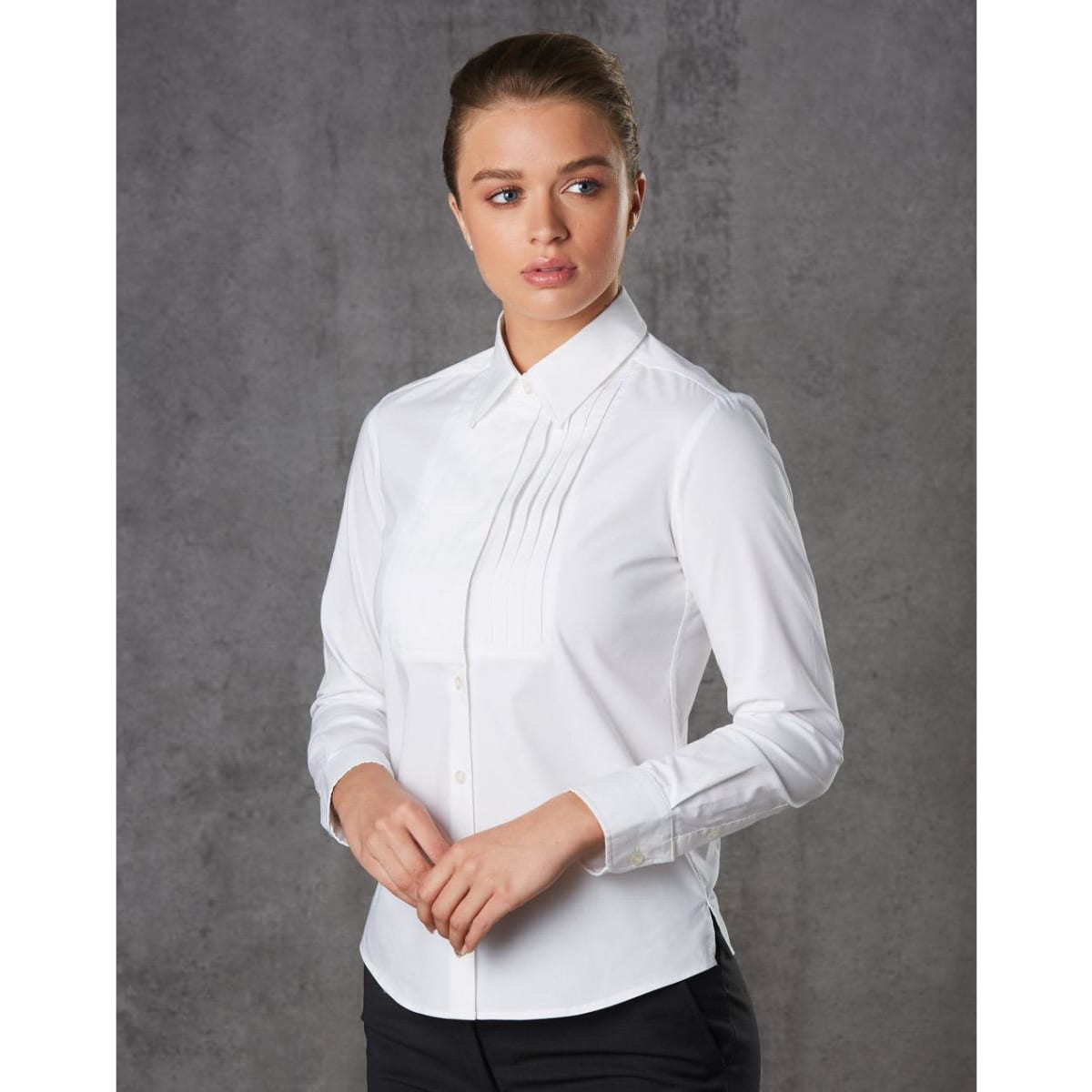 A white long sleeve button-up shirt with a tuck front design, featuring a branding logo.