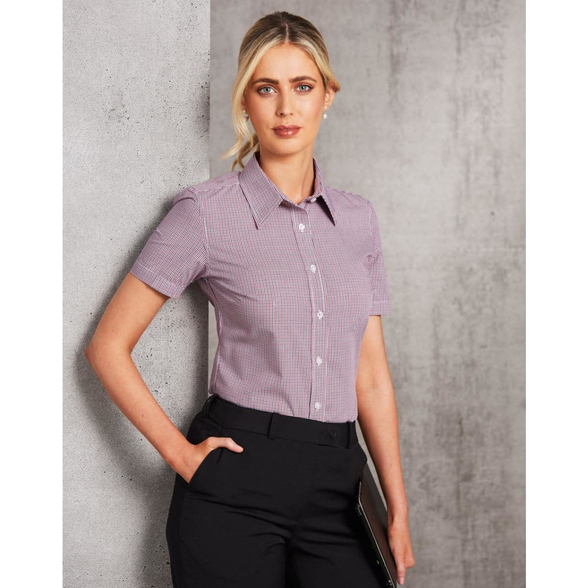 Ladies' short-sleeve button-up shirt in two tones of pink and white check, featuring a collar and buttons.