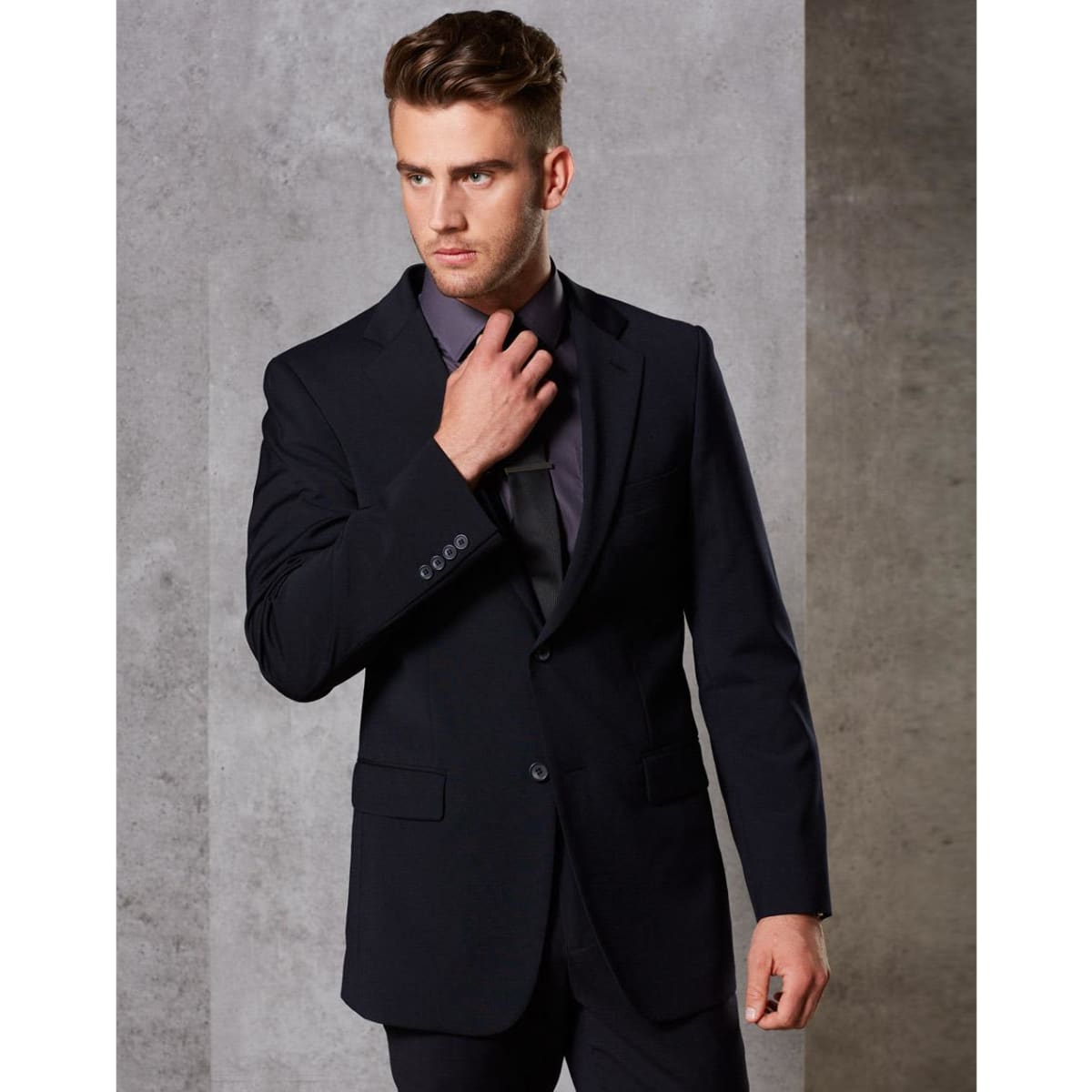 A tailored men's jacket in dark navy wool stretch, featuring two buttons and a sleek silhouette.