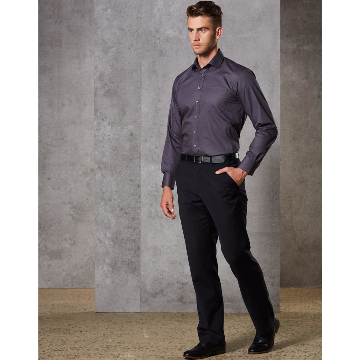 Men's stretch flexi waist pants in black paired with a grey long-sleeved shirt and black shoes, featuring a logo.