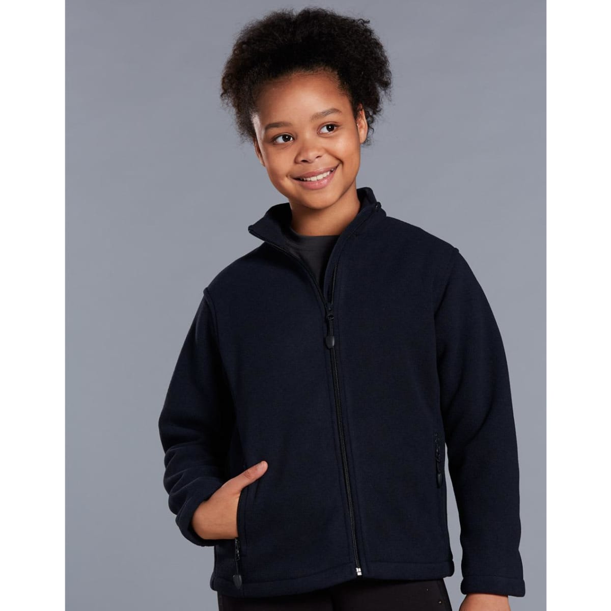 A black polar fleece jacket for kids with a full zip and zippered pockets, featuring a logo on the chest.