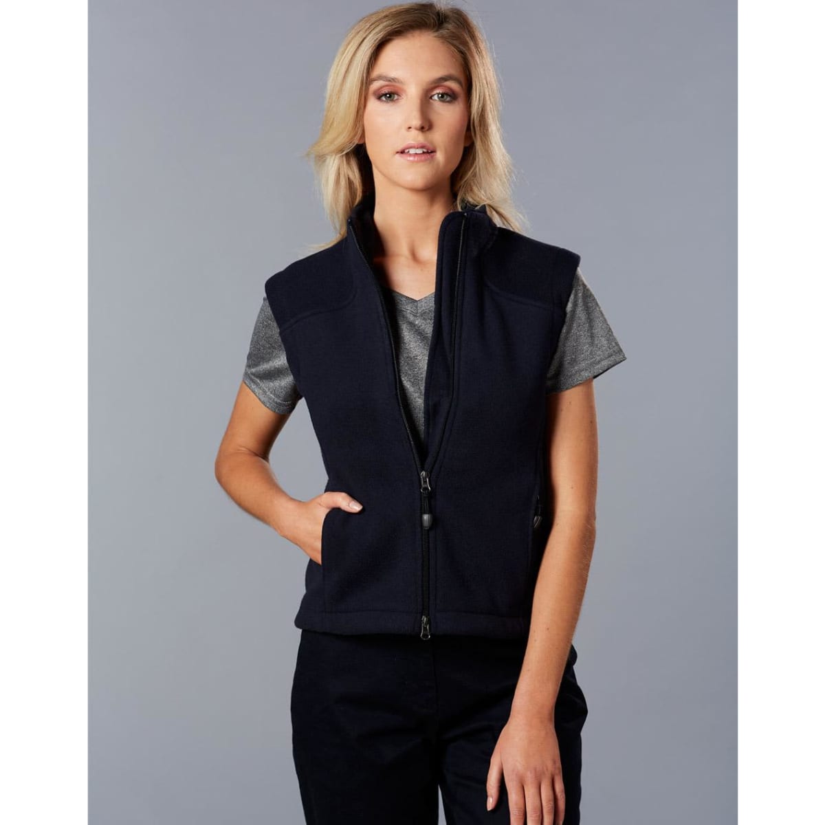 A ladies' bonded polar fleece vest in navy blue, featuring a zip front and a logo on the chest.