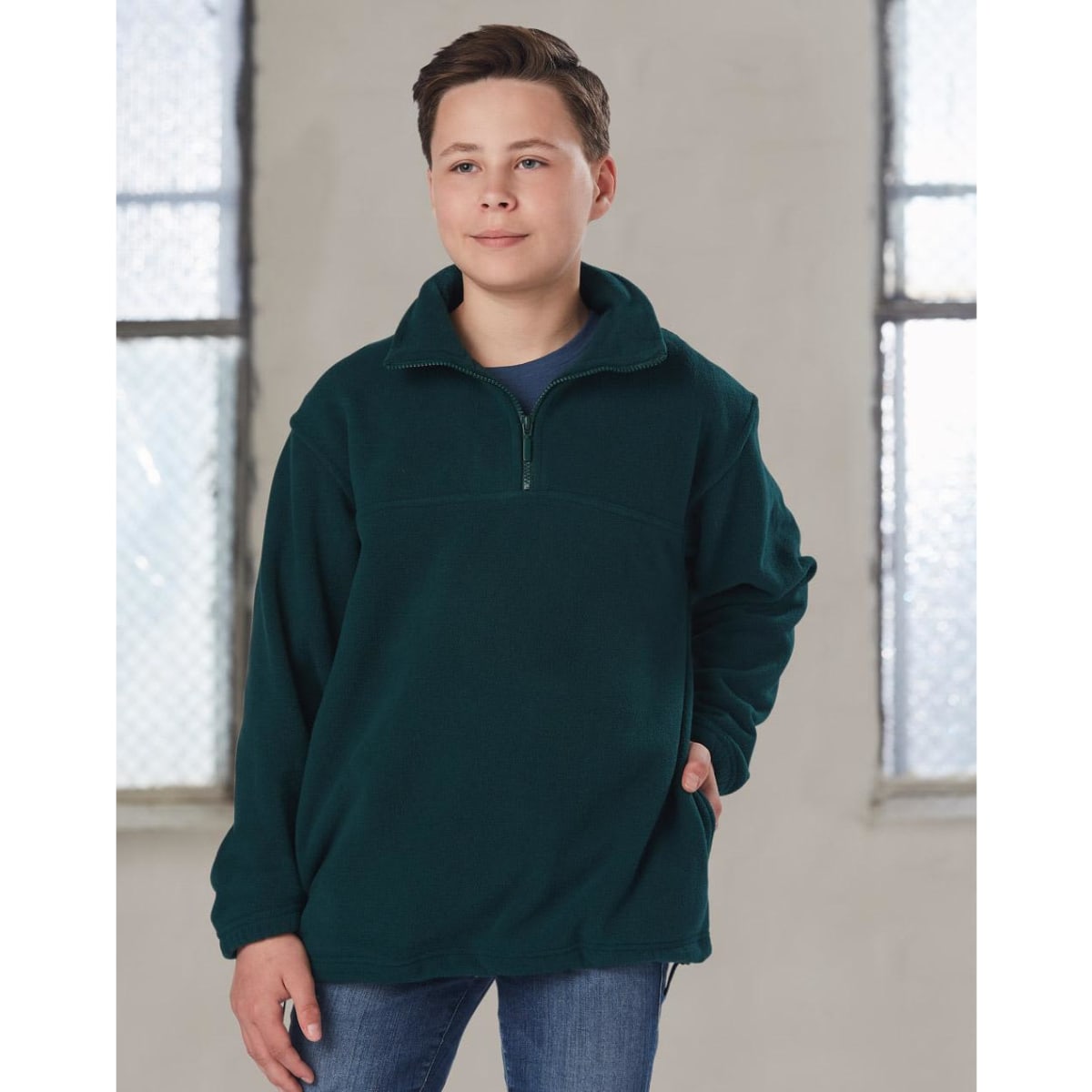 A dark green polar fleece pullover for kids, featuring a quarter zip and a front pocket.