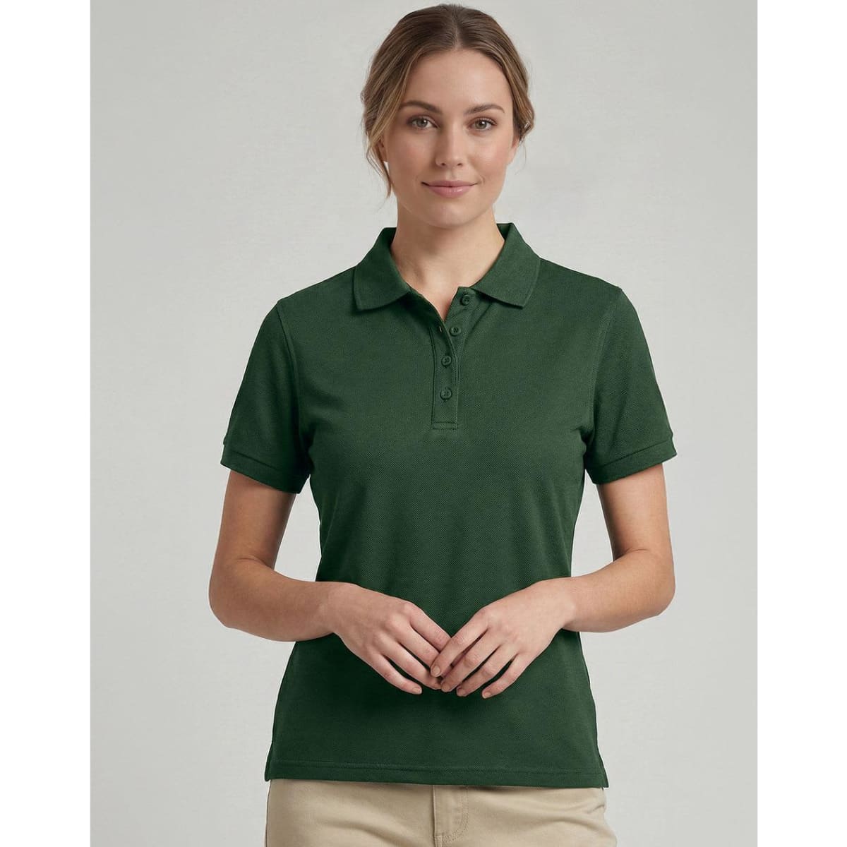 A green ladies' classic cotton/poly pique short sleeve polo with a collar and a logo on the chest.
