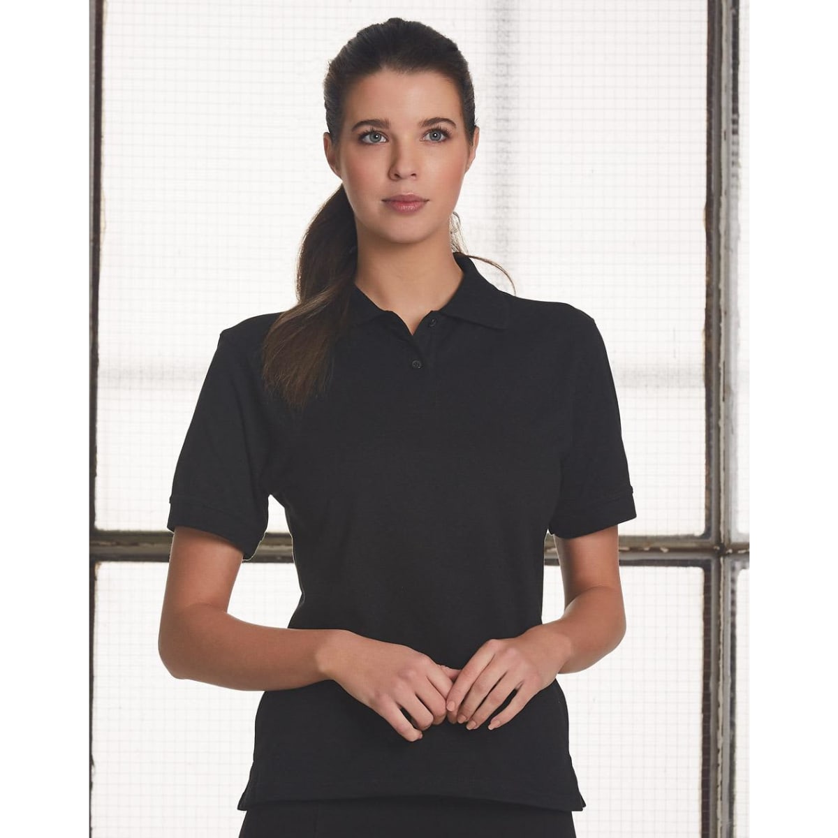 A black ladies' polo shirt with short sleeves and a collar, featuring a logo on the chest area.