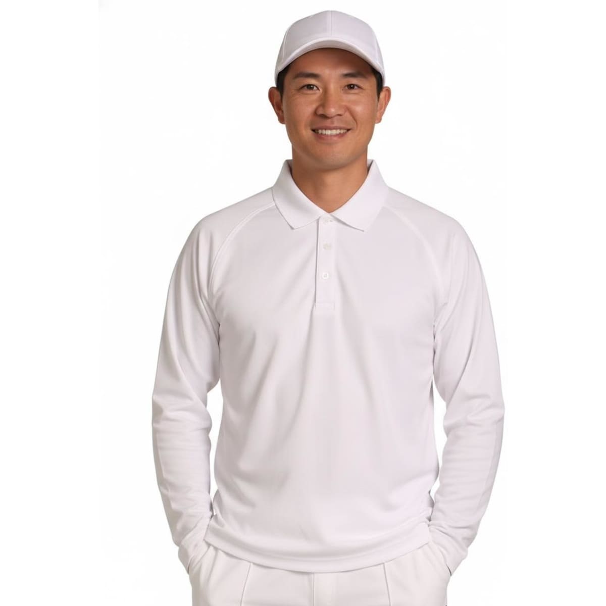 A long-sleeved white cricket polo shirt displayed on a smiling man wearing a matching white cap.