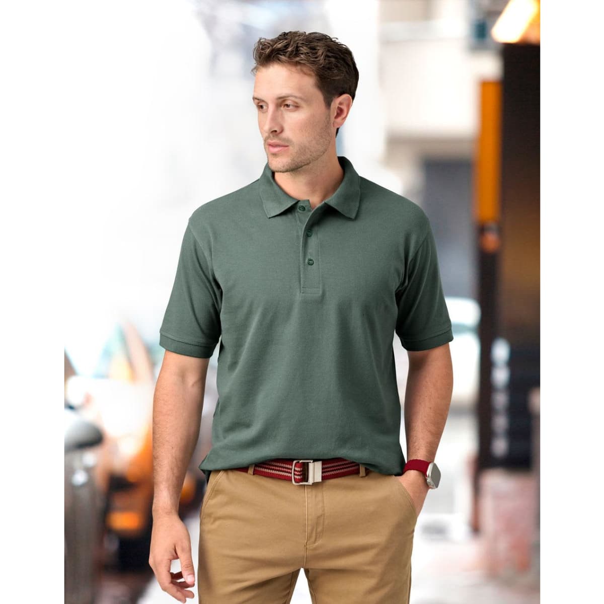 A green polo shirt with a collar, featuring short sleeves and a logo on the chest.