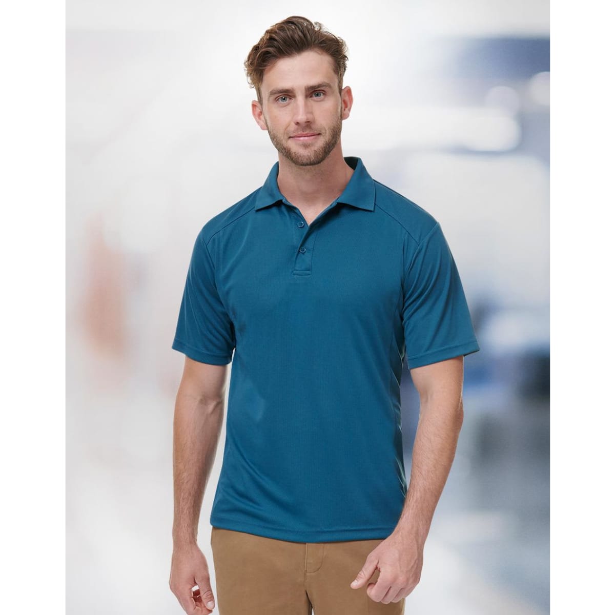 A men's short-sleeve polo shirt in a vibrant blue colour, featuring a collar and an emblem.